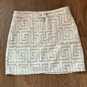NWOT Gold shimmer mini skirt. Vici